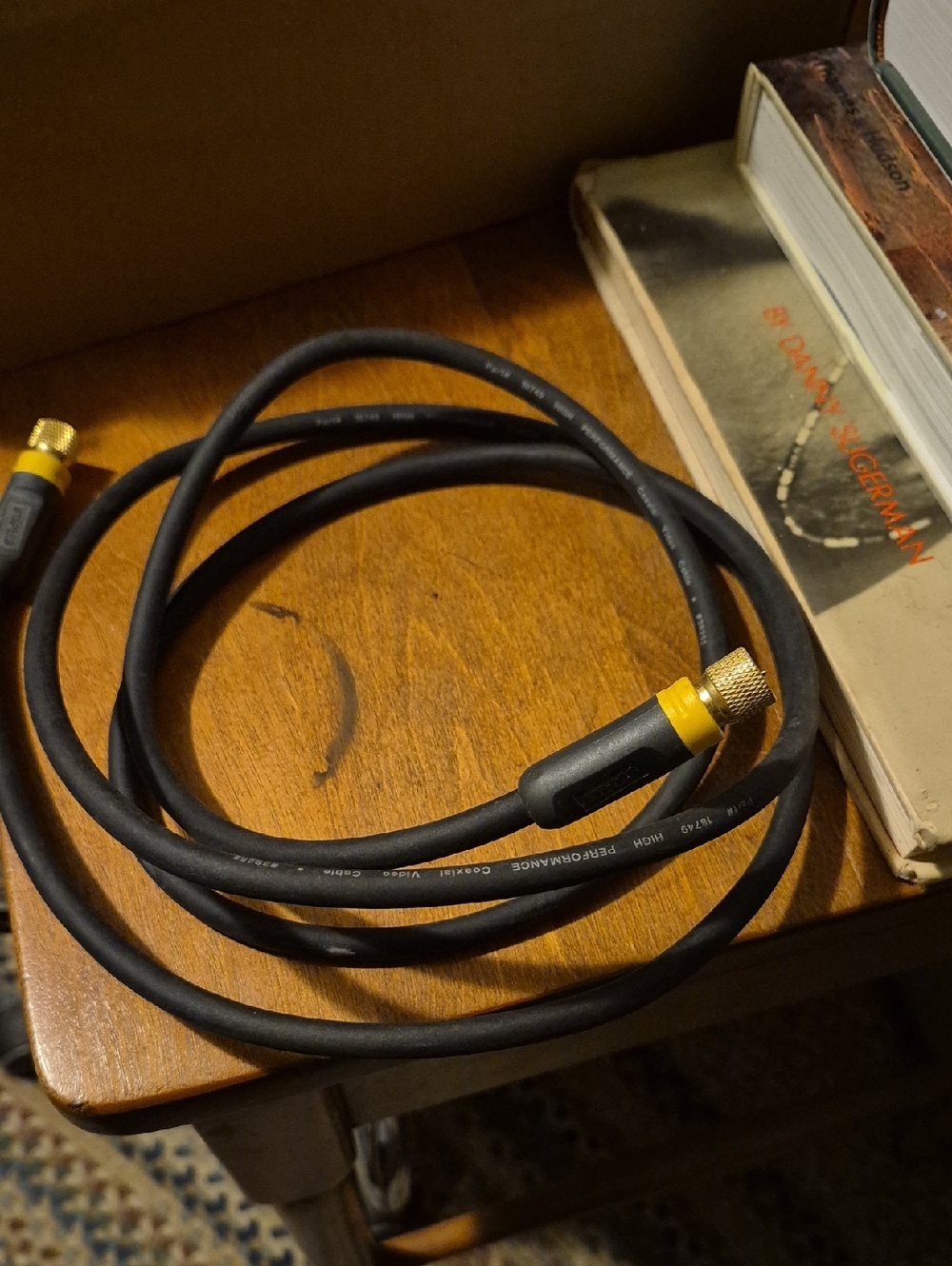 Black RF Coaxial Cable with Yellow Connector Caps